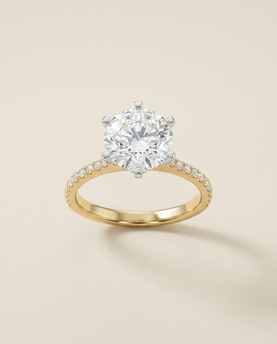 Mara signature round-brilliant solitaire engagement ring in two-tone yellow gold and platinum with pavé band